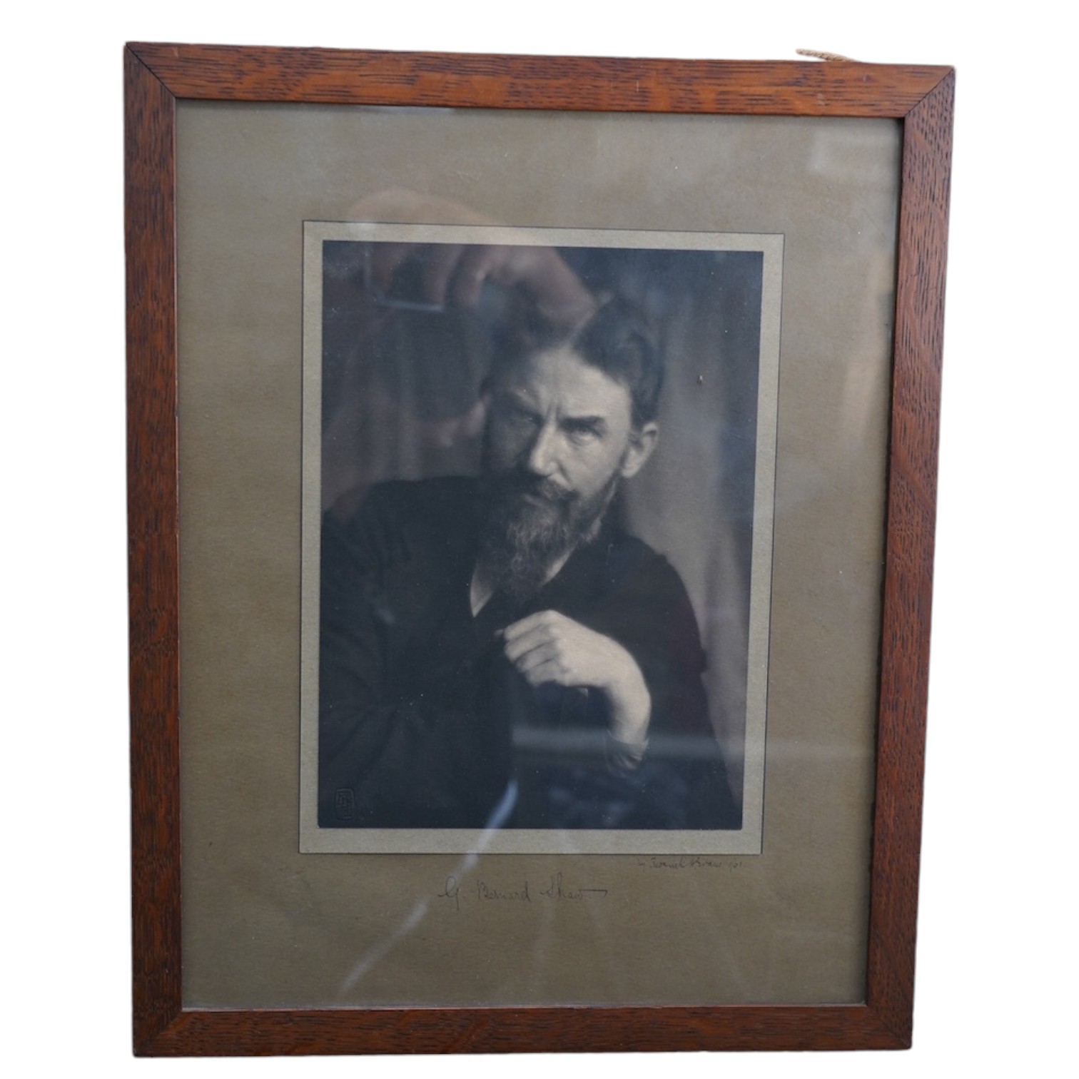 A signed photograph of George Bernard Shaw, also signed by the photographer Frederick H. Evans and dated 1901, in a contemporary oak frame 39 x 31cm, both signatures on the mount. Condition - good